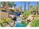 Scenic water feature with multiple tiers of cascading waterfalls, lush greenery, and natural stone accents at 9708 E Via Linda -- # 1338, Scottsdale, AZ 85258