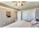 Bedroom with a view into hallway, neutral walls, and plenty of closet space at 9805 W Burns Dr, Sun City, AZ 85351