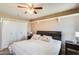 Bedroom featuring a queen bed, ceiling fan and closet for ample storage at 9805 W Burns Dr, Sun City, AZ 85351