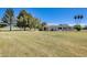 Sprawling lawn showcasing a home with mature trees and a serene setting at 9805 W Burns Dr, Sun City, AZ 85351