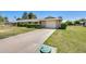 Lovely single-story home boasts a two car garage and long driveway at 9805 W Burns Dr, Sun City, AZ 85351
