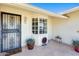 Inviting front porch with tile flooring and bay window at 9805 W Burns Dr, Sun City, AZ 85351