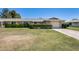 Charming single-story home with a well-manicured lawn and mature landscaping at 9805 W Burns Dr, Sun City, AZ 85351