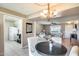 Bright open-concept living and dining area featuring hardwood floors, ample natural light and neutral color palette at 9805 W Burns Dr, Sun City, AZ 85351