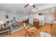 Bright living room boasts a fireplace, wood floors, and an open floor plan flowing into the kitchen at 1826 E Frier Dr # 2, Phoenix, AZ 85020