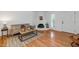 Cozy living room boasts a decorative fireplace, wood floors, and is flooded with natural light at 1826 E Frier Dr # 2, Phoenix, AZ 85020