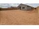 Spacious, dirt backyard offering potential for landscaping at 2680 E Santa Rosalia Dr, Casa Grande, AZ 85194
