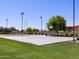 Community basketball court near a green space and a shade-covered picnic area for neighborhood recreation and relaxation at 2680 E Santa Rosalia Dr, Casa Grande, AZ 85194