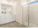 Bathroom featuring a glass-enclosed shower, double sink vanity, and tile floors at 2680 E Santa Rosalia Dr, Casa Grande, AZ 85194