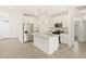 Bright kitchen featuring stainless steel appliances, granite countertops and a center island with pendant lighting at 2680 E Santa Rosalia Dr, Casa Grande, AZ 85194