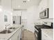 Bright kitchen featuring stainless steel appliances, granite countertops and white cabinetry at 2680 E Santa Rosalia Dr, Casa Grande, AZ 85194