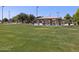 Expansive green space with a picnic pavilion and playground visible, perfect for community gatherings and Gathering outings at 2680 E Santa Rosalia Dr, Casa Grande, AZ 85194