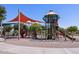 Spacious playground featuring slides, climbing structures, and shade canopies, inviting for outdoor play and community engagement at 2680 E Santa Rosalia Dr, Casa Grande, AZ 85194