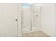 Bathroom featuring glass shower, white shelving, and tile flooring at 2680 E Santa Rosalia Dr, Casa Grande, AZ 85194