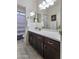 Contemporary bathroom features dual sinks with modern fixtures and dark cabinetry at 2903 E Quenton St, Mesa, AZ 85213
