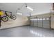 Clean two car garage featuring epoxy floors and room for storage at 2903 E Quenton St, Mesa, AZ 85213