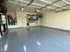 Clean and organized garage featuring epoxy flooring and functional storage solutions for tools and equipment at 2903 E Quenton St, Mesa, AZ 85213