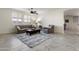 Inviting living room features modern furnishings, neutral color palette and plantation shutters at 2903 E Quenton St, Mesa, AZ 85213