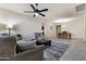 Spacious living room with view of dining room and tile floors throughout the space at 2903 E Quenton St, Mesa, AZ 85213