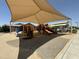 Community playground featuring slides, climbing structures, and shade canopies, ideal for outdoor fun at 2903 E Quenton St, Mesa, AZ 85213