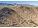 Expansive aerial view shows desert landscape and mountain views perfect for building a custom home at 3388 N Highlands Dr # 38, Buckeye, AZ 85396