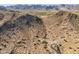 Expansive aerial view shows desert landscape and mountain views perfect for building a custom home at 3388 N Highlands Dr # 38, Buckeye, AZ 85396