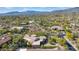 Custom home with lush desert landscaping plus spectacular mountain views in this neighborhood aerial shot at 37334 N Winding Wash Trl, Carefree, AZ 85377