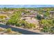 An aerial view of a neighborhood featuring well-maintained desert landscaping and custom luxury homes at 37334 N Winding Wash Trl, Carefree, AZ 85377