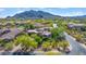 Beautiful home has lush desert landscaping and mature trees plus neighborhood views from this amazing aerial shot at 37334 N Winding Wash Trl, Carefree, AZ 85377