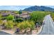 Beautiful home has desert landscaping and mature trees plus amazing views from this gorgeous aerial shot at 37334 N Winding Wash Trl, Carefree, AZ 85377