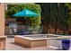 Backyard featuring a pool, dining set, and BBQ at 37334 N Winding Wash Trl, Carefree, AZ 85377