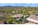 A relaxing backyard with pool and spa, patio space, and lush desert landscaping creates a private retreat at 37334 N Winding Wash Trl, Carefree, AZ 85377