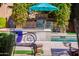 Backyard featuring a pool, dining set, and BBQ at 37334 N Winding Wash Trl, Carefree, AZ 85377