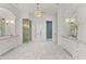 Grand bathroom with dual vanities, marble floors, and a glass enclosed shower at 37334 N Winding Wash Trl, Carefree, AZ 85377