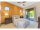 Bedroom featuring a ceiling fan, stylish modern decor, and outdoor access at 37334 N Winding Wash Trl, Carefree, AZ 85377