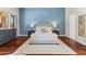 Comfortable bedroom with a king-size bed, stylish furnishings, and calming blue accents at 37334 N Winding Wash Trl, Carefree, AZ 85377