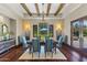 Formal dining room with wooden table, designer chairs, and natural light at 37334 N Winding Wash Trl, Carefree, AZ 85377