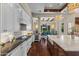 Gourmet kitchen with wine fridge and views of the dining area at 37334 N Winding Wash Trl, Carefree, AZ 85377