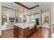 Gourmet kitchen with large island, farmhouse sink, and hardwood floors at 37334 N Winding Wash Trl, Carefree, AZ 85377