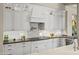 Bright white kitchen with custom cabinets and stainless steel appliances at 37334 N Winding Wash Trl, Carefree, AZ 85377