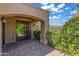 Covered patio with stone accents and sliding glass doors at 37334 N Winding Wash Trl, Carefree, AZ 85377