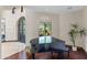 Sophisticated piano room with hardwood flooring, large windows, and ample natural light for an elegant ambiance at 37334 N Winding Wash Trl, Carefree, AZ 85377