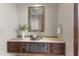 Stylish powder room with a decorative vanity, unique sink, and elegant mirror at 37334 N Winding Wash Trl, Carefree, AZ 85377