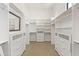 Spacious walk-in closet with custom shelving, drawers, and ample storage space at 37334 N Winding Wash Trl, Carefree, AZ 85377