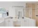Bright bathroom with double sinks, tub, and a tiled shower at 4422 E Dry Creek Rd, Phoenix, AZ 85044
