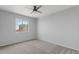 Neutral bedroom featuring carpet, a ceiling fan, and natural light from the window at 4422 E Dry Creek Rd, Phoenix, AZ 85044