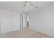 Bedroom featuring a ceiling fan, closet and a doorway to another space in the home at 4422 E Dry Creek Rd, Phoenix, AZ 85044