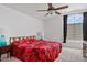 Spacious bedroom with a ceiling fan and a large window for natural light at 4422 E Dry Creek Rd, Phoenix, AZ 85044