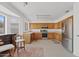 Bright kitchen with natural wood cabinets, stainless steel appliances, and a spacious layout at 4422 E Dry Creek Rd, Phoenix, AZ 85044