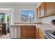 Bright kitchen features stainless steel appliances and a window with a view to the outside at 4422 E Dry Creek Rd, Phoenix, AZ 85044